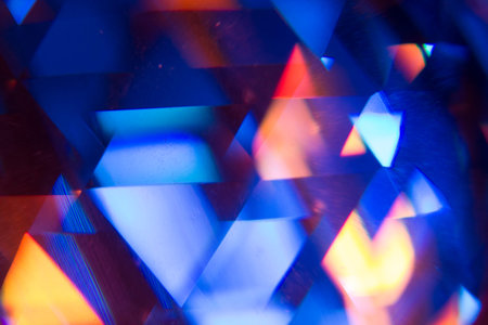 Colorful light leak on black background, abstract with optical lens flare shot on a true photo lens.の写真素材