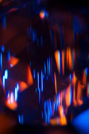 Colorful light leak on black background, abstract with optical lens flare shot on a true photo lens.