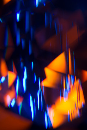 Colorful light leak on black background, abstract with optical lens flare shot on a true photo lens.の写真素材