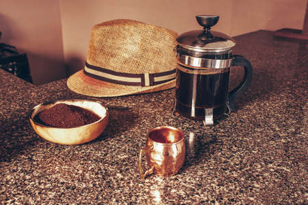 espresso coffee cup and french coffee maker with handmade ground coffee bowl and Cuban hatの写真素材