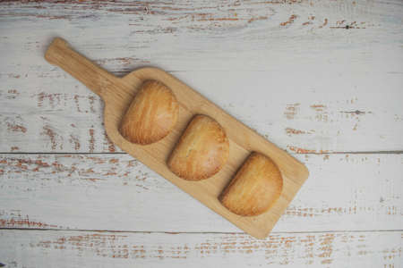 Hand Pies on clapboard on white wooden tableの写真素材