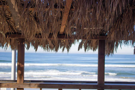 wooden terrace on the beach with a beautiful view of the Mediterranean seaの写真素材