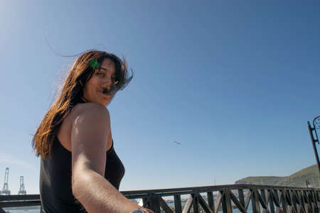beautiful mexican woman looking smilingの写真素材