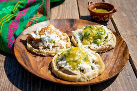 classic mexican food dish with sopes with saucesの写真素材