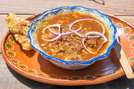 mexican food with birria, hot sauce and chicharronの写真素材