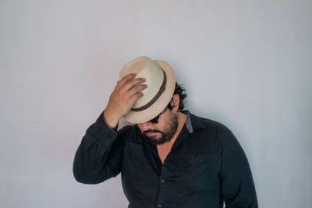 Elegant Mexican man wearing sombrero and sunglasses. with a model attitudeの写真素材