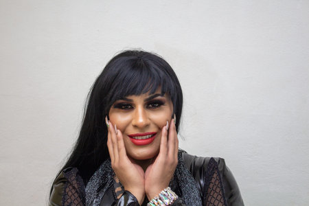 portrait of transgender latina wearing an exotic drag queen costume. transsexual