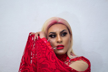 hispani transgender with cape wearing an exotic drag queen costume. transsexualの写真素材