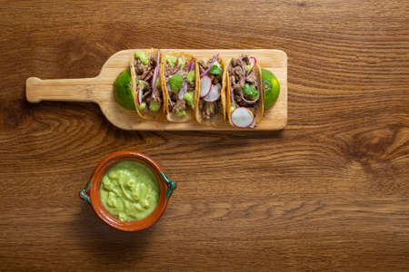top view of Mexican tacos with guacamole and onion. gourmet mexican foodの写真素材
