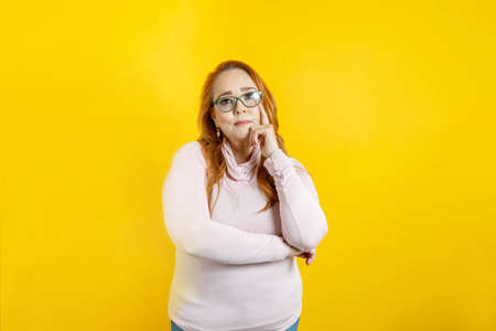 portrait of mature caucasian mexican woman looking at cameraの写真素材