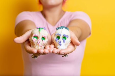 woman showing sugar skulls. catrinas of the day of the dead. Mexican traditionの写真素材