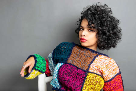 beautiful curly haired hispanic latina model with perfect skinの写真素材