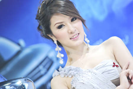 BANGKOK - DECEMBER 3: Female presenters model at the Mitsubishi booth during Bangkok International Motor Show at Impact Challenger on December 3, 2011 in Bangkok, Thailand.のeditorial素材