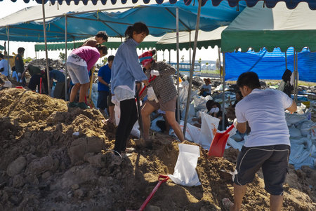 Bangkok THAILAND - OCT 31: Thai volunteers made sand bags for protecting Bangkok from flood on...
