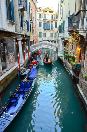 typical urban view with canal, boats and houses in Venice - Italyのeditorial素材
