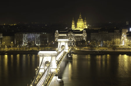 HDR View of Chain Bridge and St. Stephen's Basilica at night.Budapest, Hungaryのeditorial素材