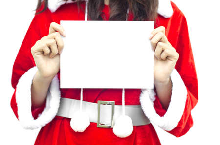 Girl in Santa holding banner. Cute funny  closeup of christmas woman with copyspace. Isolated on white background.の写真素材