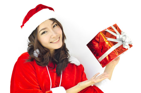 Portrait of young beautiful woman in santa claus hat with red christmas gift box with grey ribbons.
