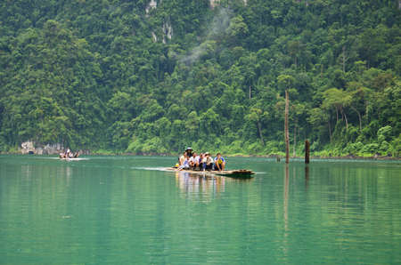 SURAT THANI, THAILAND - NOV 24, 2012 : Tourist arrival by long tail boat in the morning at Ratchaprapha Dam at Khao Sok National Park, Nov 24, 2012 in Thailandのeditorial素材