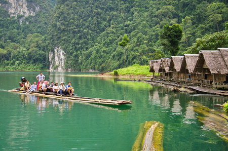 SURAT THANI, THAILAND - NOV 24, 2012 : Tourist arrival by long tail boat in the morning at...
