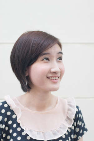 Beautiful thoughtful woman looking up-close upの写真素材