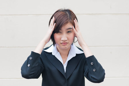 young businesswoman with headache