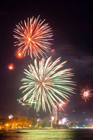 beautiful fireworks celebrating new year on patong beach thailandの写真素材