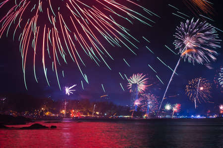 beautiful fireworks celebrating new year on patong beach thailandの写真素材