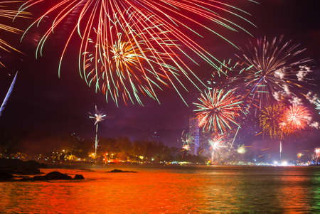 beautiful fireworks celebrating new year on patong beach thailandの写真素材