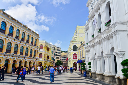MACAU-MAY 9 : Tourists visit the Historic Centre of Macao-Senado Square on May 9, 2013 in Macau, China. The Historic Centre of Macao was inscribed on the UNESCO World Heritage List in 2005.のeditorial素材