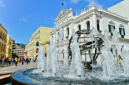 MACAU-MAY 9 : Tourists visit the Historic Centre of Macao-Senado Square on May 9, 2013 in Macau, China. The Historic Centre of Macao was inscribed on the UNESCO World Heritage List in 2005.のeditorial素材