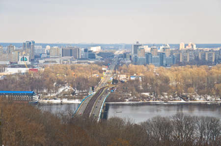 KIEV, UKRAINE - MARCH 8: River port and bridge on a river Dnepr, March 8, 2013, in town Kiev, Ukraine, built in 1157-1961.のeditorial素材
