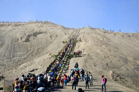 JAVA,INDONESIA-OCT 14 : Tourists hiking down from the crater of the volcano at Mount Bromo on October 14,2013 in Java , Indonesia.のeditorial素材