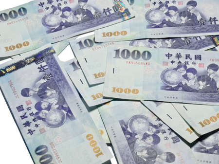 A lot of 1000 New Taiwan Dollars bill on white backgroundの写真素材