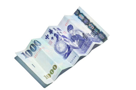 A 1000 New Taiwan Dollars bill on white backgroundの写真素材