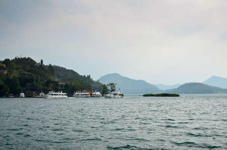 SUN MOON LAKE - OCT 25: many boats parking at the pier on October 25, 2013 at Sun Moon Lake, Taiwan. Sun Moon Lake is the largest body of water in Taiwan as well as a tourist attraction.のeditorial素材