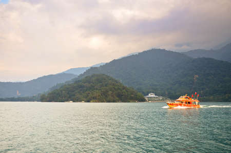 SUN MOON LAKE - OCT 25: many boats parking at the pier on October 25, 2013 at Sun Moon Lake, Taiwan. Sun Moon Lake is the largest body of water in Taiwan as well as a tourist attraction.のeditorial素材