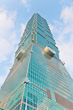 TAIPEI, TAIWAN - OCT 26 : A view to Taipei 101 from busy corner in Xinyi financial district of Taipei city October 26, 2013 in Taipei, TW. The building is the world's second tallest at 509 meters.のeditorial素材