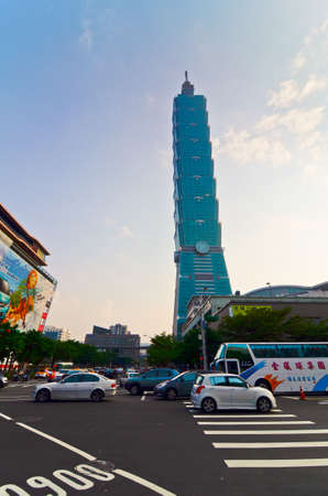 TAIPEI, TAIWAN - OCT 26 : A view to Taipei 101 from busy corner in Xinyi financial district of Taipei city October 26, 2013 in Taipei, TW. The building is the world's second tallest at 509 meters.のeditorial素材