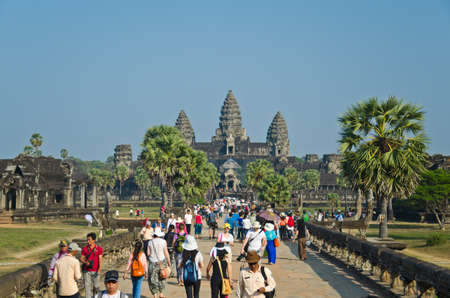 ANGKOR WAT - JAN ,4 : tourists at temple Angkor Wat on Jan 4,2014 in Siem Reap,Cambodia.Templ es of Angkor are the most famous attraction in Cambodia with more than 2 milion visitors per year.のeditorial素材