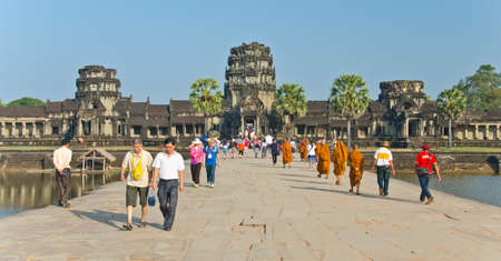 SIEM REAP, CAMBODIA - JAN 04: Monks  in Angkor Wat temple, January 04, 2014, Siem Reap, Cambodia. Buddhism is currently estimated to be the faith of 96% of the Cambodian population.のeditorial素材
