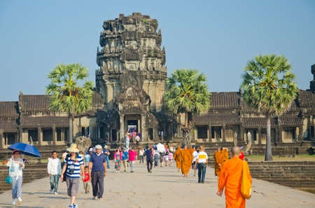 SIEM REAP, CAMBODIA - JAN 04: Monks  in Angkor Wat temple, January 04, 2014, Siem Reap, Cambodia. Buddhism is currently estimated to be the faith of 96% of the Cambodian population.のeditorial素材