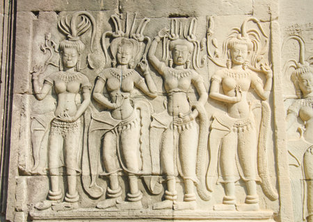 Relief of three dancers in the court of Angkor. Angkor Wat