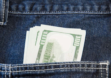 100 U.S. dollars in the back jeans pocketの写真素材