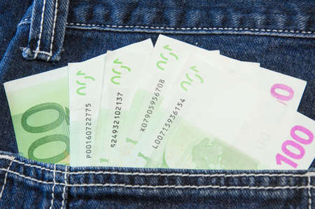 Euro notes in jeans pocketの写真素材