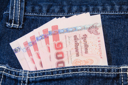 Thai baht notes in jeans pocket