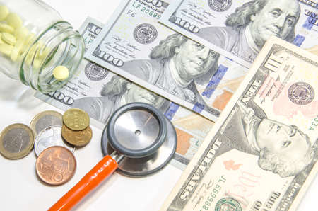 Medical still life with stethoscope, money, Isolated.の写真素材