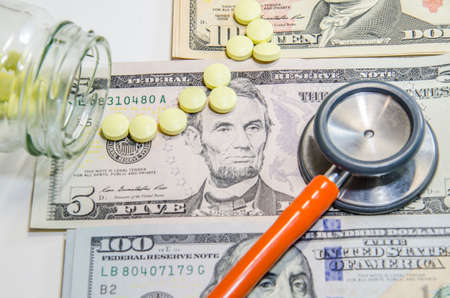 Medical still life with stethoscope, money, Isolated.の写真素材