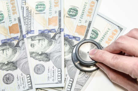 Medical still life with stethoscope, money, Isolated.の写真素材