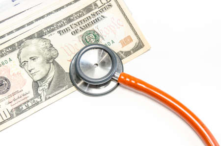 Medical still life with stethoscope, money, Isolated.の写真素材